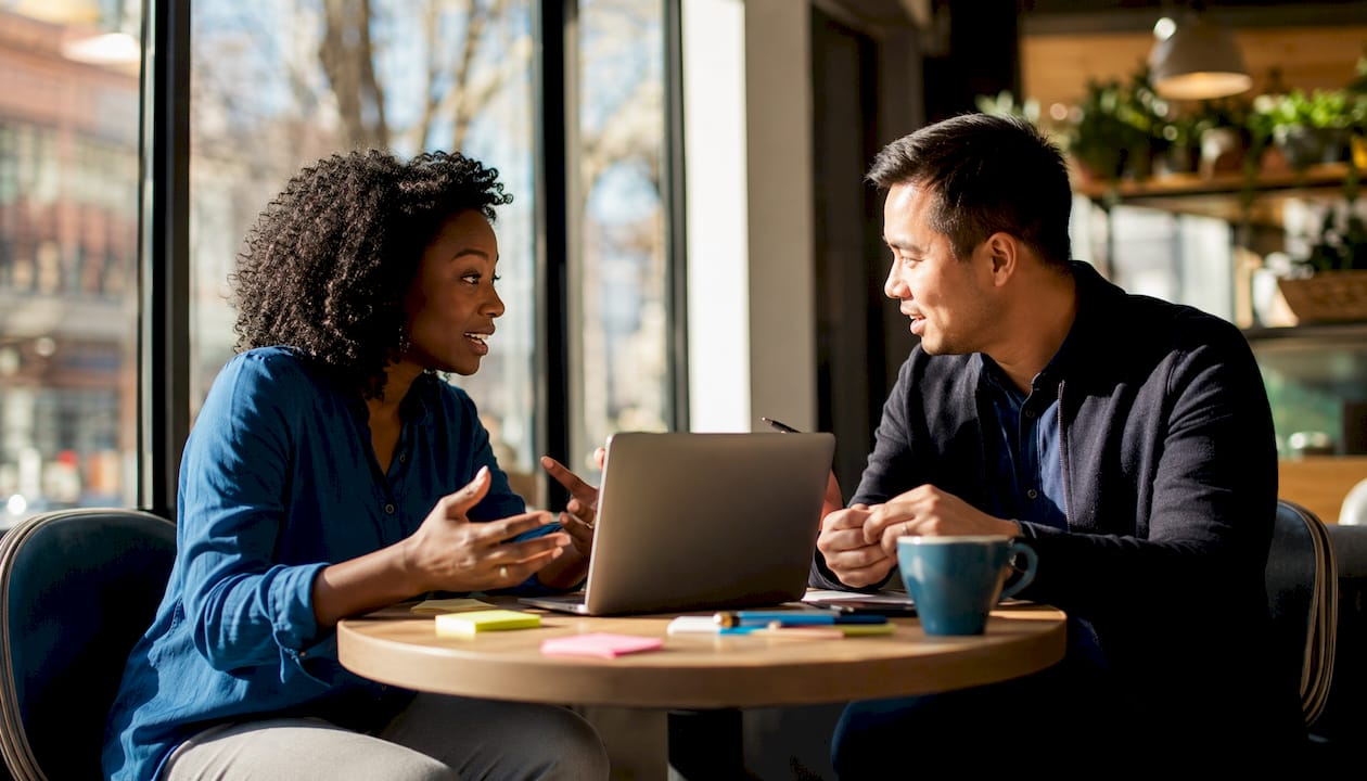 Recruiters discussing hiring strategies at table
