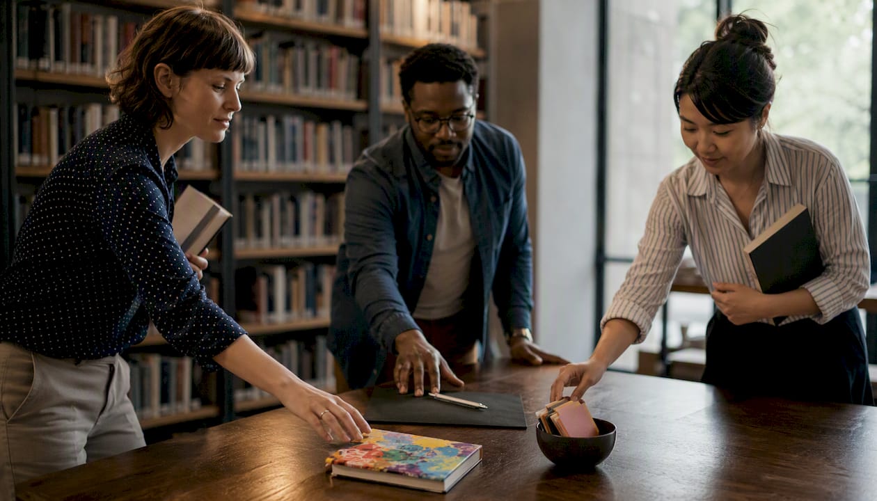 Hands of diverse professionals selecting brand objects
