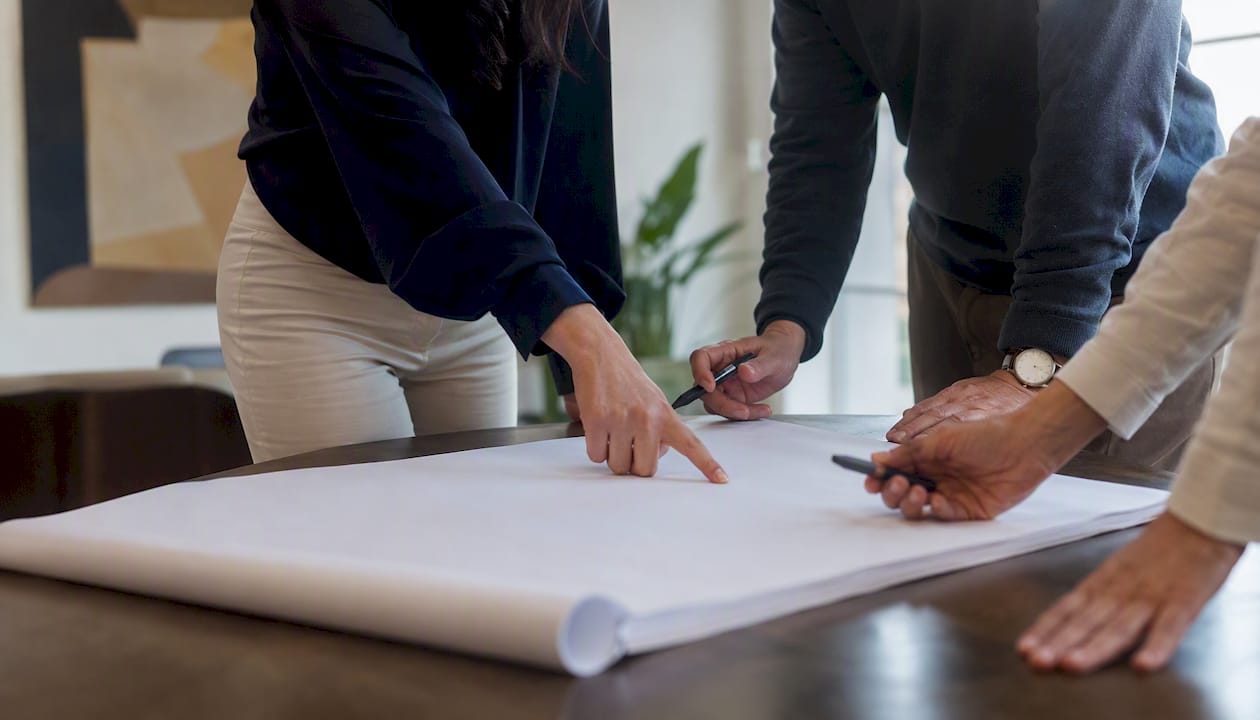 Hands mentoring with organizational chart